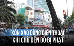 Xôn xao dùng điện thoại khi chờ đèn đỏ bị phạt, Cục CSGT nói gì?