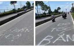 CSGT TP.HCM xóa dòng chữ 'bắn tốc độ' trên mặt đường Lê Quang Đạo