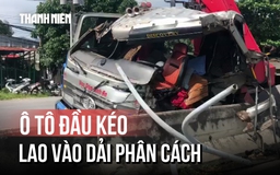 Hoảng hồn vì ô tô đầu kéo có cần cẩu lao thẳng vào dải phân cách