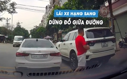 Bức xúc tài xế ngang nhiên dừng đỗ ô tô giữa đường, mặc kệ các xe khác