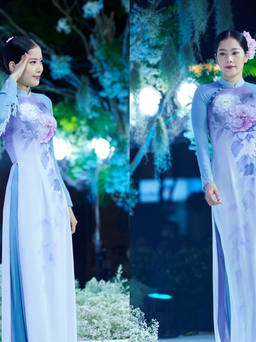 Nam Em thướt tha trong tà áo dài lụa vẽ tay