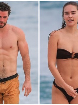 Hậu ly hôn, Liam Hemsworth lộ ảnh tắm biển với siêu mẫu 9X