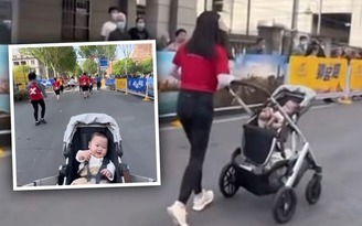 Người phụ nữ hoàn thành marathon với con trai trong xe đẩy làm nhiều người thích thú