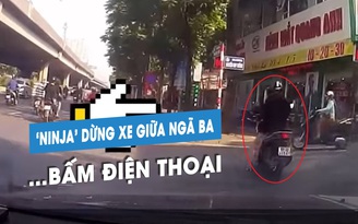 Bó tay 'nữ ninja' lái xe máy đứng giữa ngã ba… để nghe điện thoại