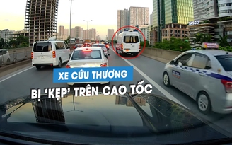 Xe cứu thương bị hàng loạt ô tô chạy sai luật 'kẹp' trên làn dừng khẩn cấp