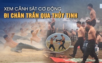 Xem cảnh sát cơ động đi chân trần qua đống thủy tinh