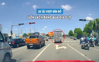 Xe tải ngang nhiên vượt đèn đỏ, luồn lách giữa hàng xe để băng qua giao lộ