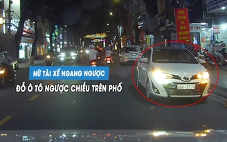 Nữ tài xế ngang ngược đỗ ô tô ngược chiều trên phố... chờ đón con