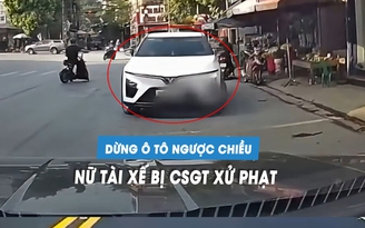 Nữ tài xế bị CSGT xử phạt vì dừng ô tô ngược chiều trên quốc lộ Nữ tài xế bị CSGT xử phạt vì dừng ô tô ngược chiều trên quốc lộ