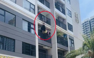 Giận chồng khi uống bia, vợ dọa nhảy từ tầng 4 chung cư, may mắn chồng túm được tay