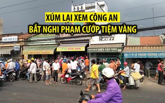 Dân xúm lại xem công an bắt nghi phạm cướp tiệm vàng bằng roi điện Dân xúm lại xem công an bắt nghi phạm cướp tiệm vàng bằng roi điện