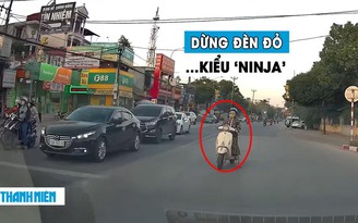 ‘Dở khóc dở cười’ nữ ninja lái xe máy dừng đèn đỏ trên đường ngược chiều