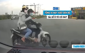 Xe máy vượt đèn đỏ bị ô tô tông văng: Dân mạng tranh cãi