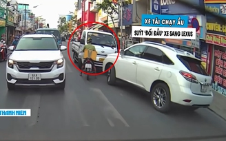 Dừng đèn đỏ trên làn ngược chiều, xe tải suýt ‘đối đầu’ với xe sang Lexus