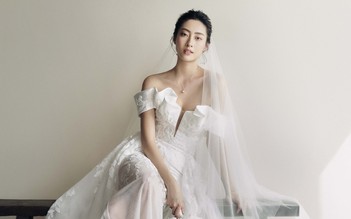 Hoa hậu Lương Thùy Linh lăng xê váy cưới hở vai