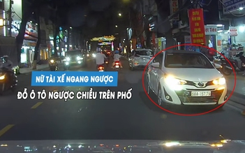 Nữ tài xế ngang ngược đỗ ô tô ngược chiều trên phố... chờ đón con