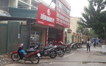 Triệu tập một nữ thiếu tá công an trong vụ nổ súng tại tiệm sửa xe ở Hà Nội