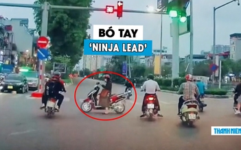‘Bó tay’ người phụ nữ vô tư dừng xe máy giữa ngã tư để… bấm điện thoại