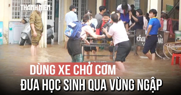 Triều cường vượt báo động 3, giáo viên dùng xe chở cơm đưa học sinh qua vùng ngập