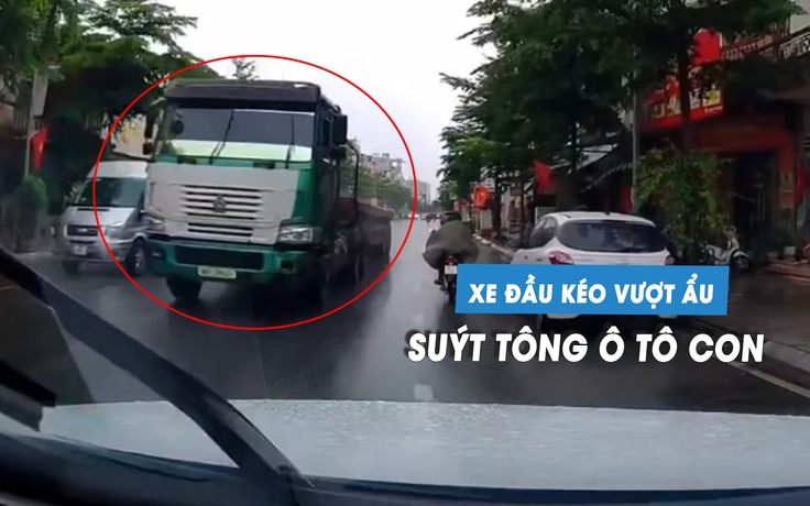 Kinh hoàng xe đầu kéo vượt ẩu, ép ô tô con vào lề đường