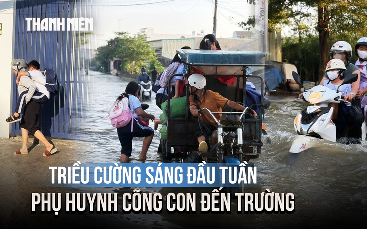 Triều cường gây ngập gần nửa mét ở TP.HCM, phụ huynh lội nước cõng con đến trường