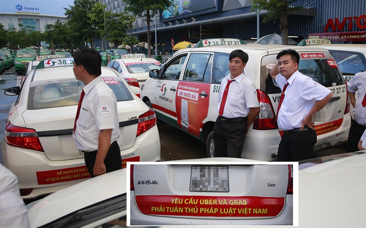 Taxi truyền thống dán khẩu hiệu phản đối Uber, Grab ở TP.HCM