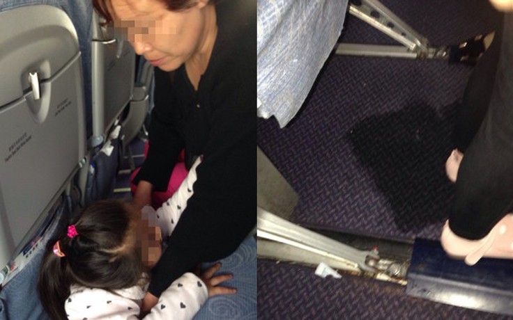 Bà cho cháu gái tè bậy ngay trên sàn máy bay