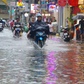 Mưa lớn ở TP.HCM chiều 2.6: Phố Tây Bùi Viện nước ngập lênh láng