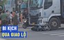 Bi kịch qua giao lộ: Xe tải cuốn xe máy vào gầm